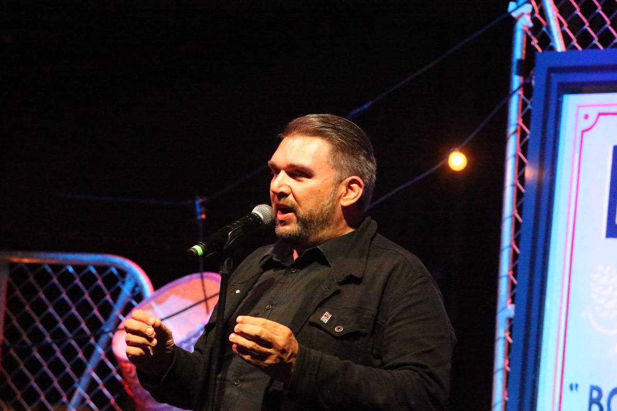 Adam Lees storytelling in front of a live audience