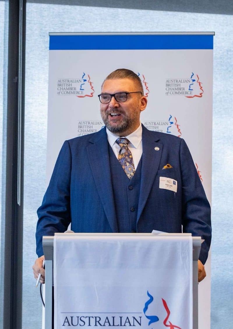 Adam Lees speaking at a conference