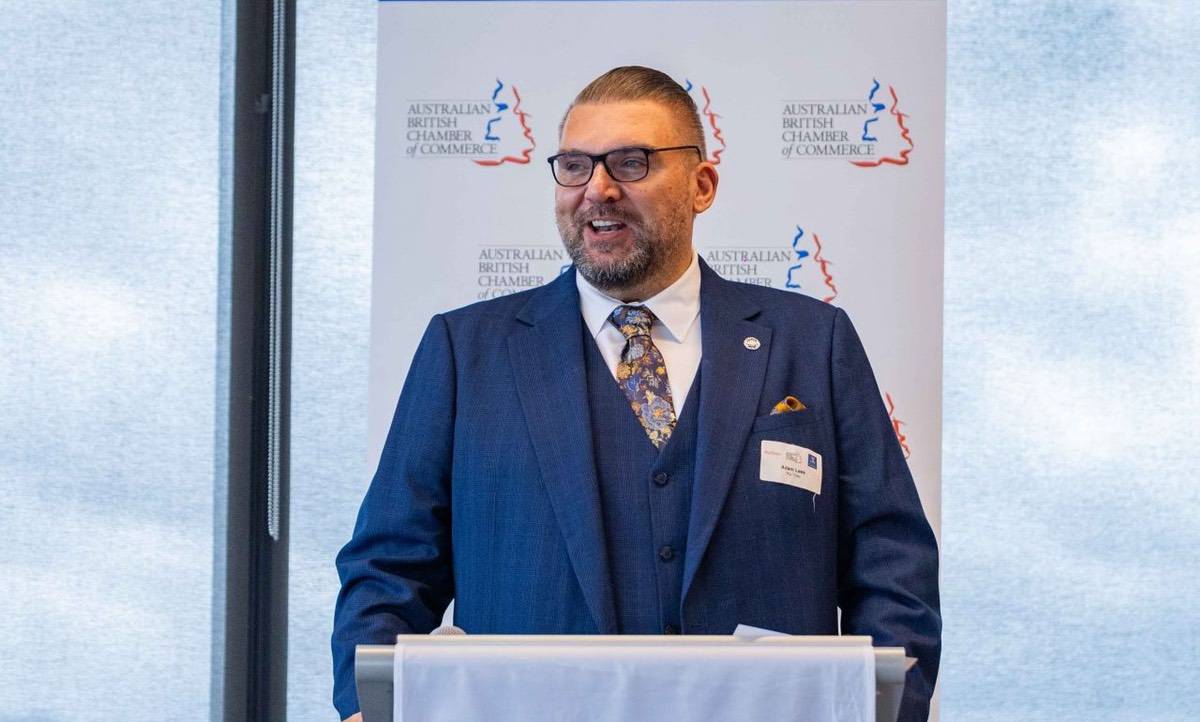 Adam Lees speaking at a conference